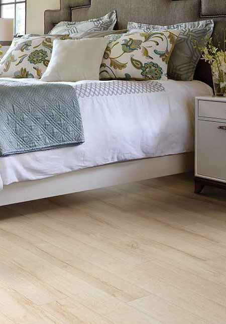 white oak look laminate in bedroom with yellow accents